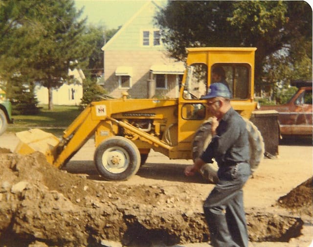 A backhoe digging a trench
