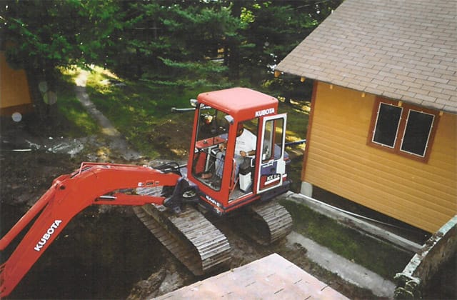 Septic system install beside a cabin