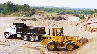 Truck and loader at the pit